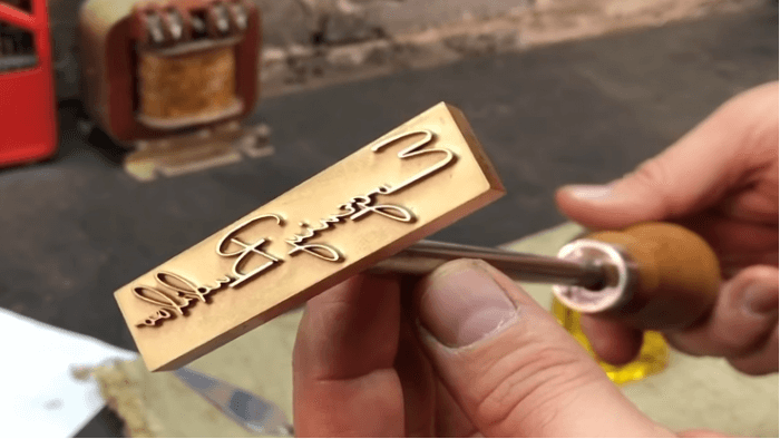Made stamps of very thick cardboard, plywood or wood